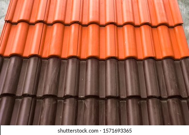 Samples Of Ceramic Roofing Tiles In A Warehouse Of A Roofing Materials Store. Modern Roof Made Of Metal. Cement Sand Tiles.