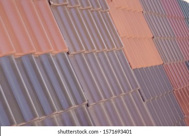 Samples Of Ceramic Roofing Tiles In A Warehouse Of A Roofing Materials Store. Modern Roof Made Of Metal. Cement Sand Tiles.