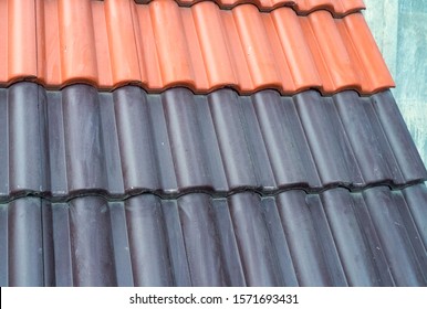 Samples Of Ceramic Roofing Tiles In A Warehouse Of A Roofing Materials Store. Modern Roof Made Of Metal. Cement Sand Tiles.