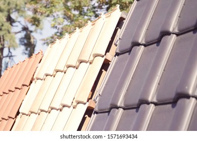 Samples Of Ceramic Roofing Tiles In A Warehouse Of A Roofing Materials Store. Modern Roof Made Of Metal. Cement Sand Tiles.