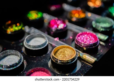 Samples Of Cosmetic Nail Art Glitter In Row On Counter For Sale In Make Up Store, Manicure Salon, Exhibition. Glamour, Fashion, Make Up, Beauty And Skincare Concept