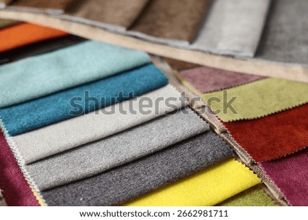 Samples of different fabrics as background, closeup