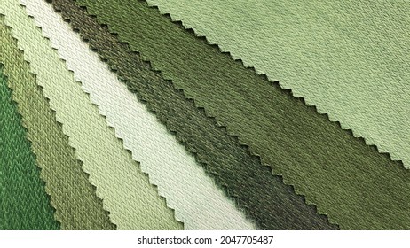 samples of fabric for interior upholstery or drapery works in green natural tone color. swatch of green olive zigzag pattern fabric. fabric for vintage interior style. close-up image.