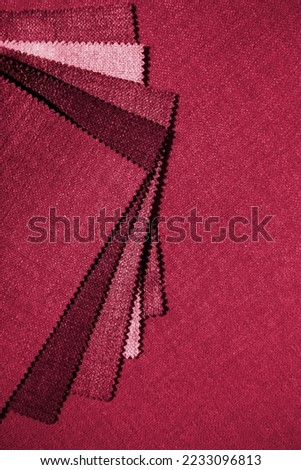 Samples of fabrics of different color and textures. New 2023 trending PANTONE 18-1750 Viva Magenta color