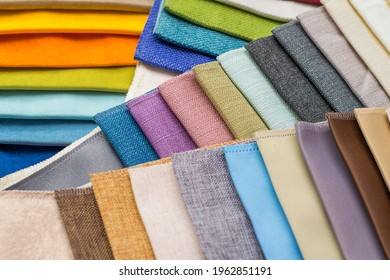 Samples of fabrics for upholstery, roman blinds. Multicolored fabric swatches close up - Shutterstock ID 1962851191