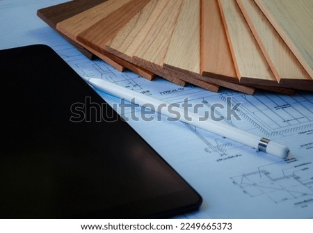 Samples of interior design materials and wood color with floor plan blueprint