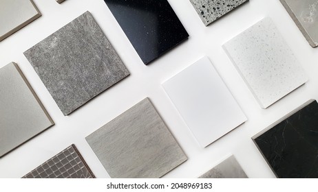 samples of interior stone material consists concrete tiles, quartz stones, artificial stones, graphic tile. top view of interior selected material for mood and tone board. interior materials palette.