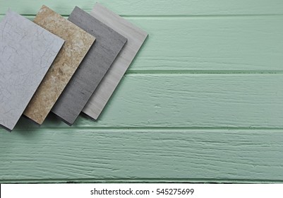 Samples Of Laminate , Vinyl , Stone , Click Lock Laminate Texture Floor Tile On Blur Building Background.psd