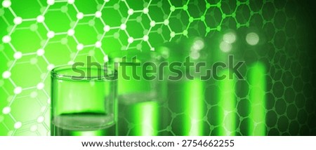 Samples in test tubes and hexagonal lattice of carbon atoms, toned in green. Biochemistry researches