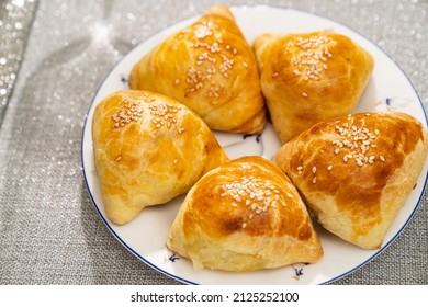 Samsa, samosa on a plate. fried in oil or baked national oriental dish with salty filling.