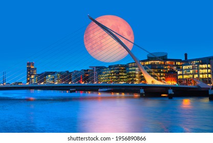 Samuel Backett Bridge (Harp Bridge) at twilight blue hour with full moon - River Liffey, Dublin  Ireland "Elements of this image furnished by NASA"