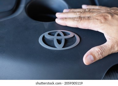 Samut Prakan, Thailand: October 16, 2021: Stainless Steel Logo On Black Toyota Brand Engine Cover, Toyota Is A Japanese Automotive Brand With A Production Base In Thailand.