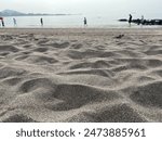 Samyang Beach. This beach is known for its black sand, which is made up of volcanic rocks that have been eroded by waves and transported by rivers over the years. 