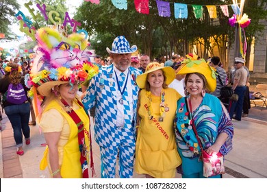 San Antonio, Texas - April 19, 2018: Elected royalty of the past poses for pictures during the opening night celebration of Fiesta San Antonio during the city's tricentennial year.