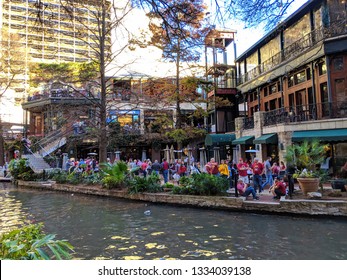 San Antonio, Texas - December 27, 2018: San Antonio River Walk With Fans From Washington State And Iowa State The Day Before The 2018 Alamo Bowl. 