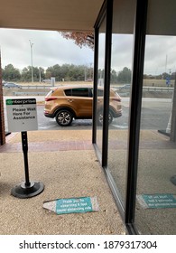 SAN ANTONIO, TEXAS USA - 12-20-2020- Enterprise Rental Car Waiting Area Social Distancing, Reflection Of A Car On Glass Wall