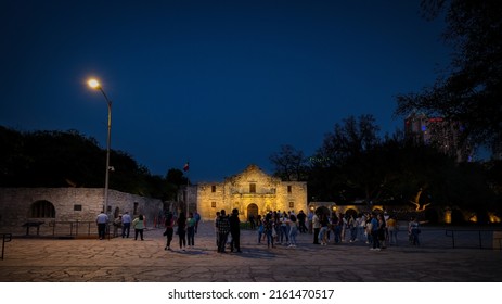 San Antonio, Texas, USA - April 28, 2022: Tourist Walk Outside The Alamo, Originally Called Mission San Antonio De Valero, Now A National Historic Landmark.