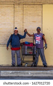 San Antonio , Texas USA November19, 2019. Two Men Holding Hands United Together Street People With Their Cart Of Goods On A San Antonio Street