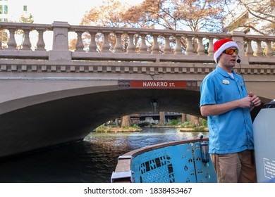 San Antonio, Texas/USA - Dec 16 2019: Tour Guide Wearing Christmas Hat On River Boat Tour In Riverwalk