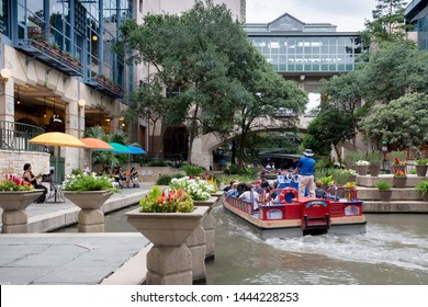 San Antonio, Texas/USA- May 18 2019: San Antonio River Walk Is Surrounded By Lush Landscapes, Cypress-line Paths, Water Falls And Vibrant City Life.