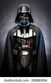 SAN BENEDETTO DEL TRONTO, ITALY. MAY 16, 2015. Portrait of Darth Vader costume replica . Darth Vader is a fictional character of Star Wars saga.  Blue grazing light, black background