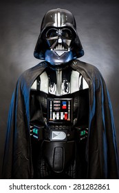 SAN BENEDETTO DEL TRONTO, ITALY. MAY 16, 2015. Portrait of Darth Vader costume replica. Darth Vader is a fictional character of Star Wars saga.  Blue grazing light, black background