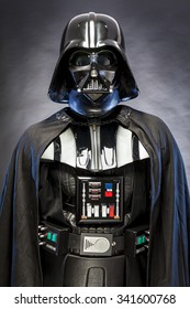 SAN BENEDETTO DEL TRONTO, ITALY. MAY 16, 2015. Portrait of Darth Vader costume replica with . Darth Vader is a fictional character of Star Wars saga.  blue grazing light , black background