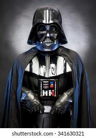 SAN BENEDETTO DEL TRONTO, ITALY. MAY 16, 2015. Half lenght portrait of Darth Vader costume replica  . Darth Vader is a fictional character of Star Wars saga. Blue grazing light and black background
