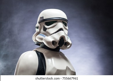 SAN BENEDETTO DEL TRONTO, ITALY. NOVEMBER 11, 2017. Studio portrait  of stormtrooper costume replica,  a fictional character of Star Wars saga. Black background with smoke