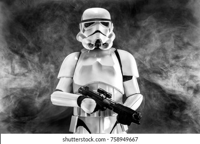 SAN BENEDETTO DEL TRONTO, ITALY. NOVEMBER 11, 2017. Studio portrait  of stormtrooper costume replica, with blaster E-11 gun. He is a fictional character of Star Wars saga. Black and white picture