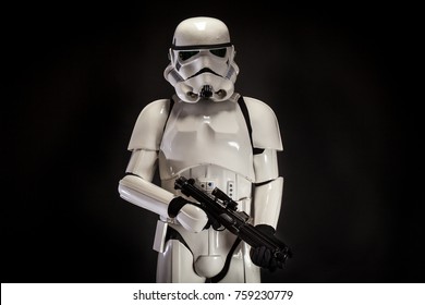 SAN BENEDETTO DEL TRONTO, ITALY. NOVEMBER 11, 2017. Studio portrait  of stormtrooper costume replica, with blaster E-11 gun. He is a fictional character of Star Wars saga. Black background 