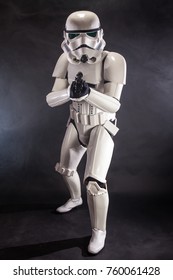SAN BENEDETTO DEL TRONTO, ITALY. NOVEMBER 11, 2017. Studio portrait  of stormtrooper costume replica, with blaster E-11 gun. He is a fictional character of Star Wars saga. Black background 