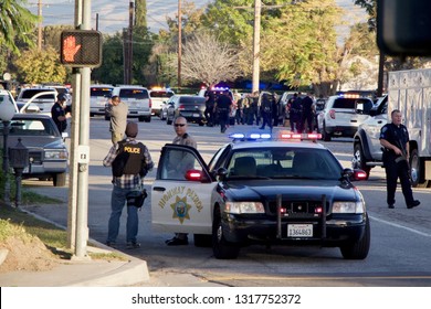 San Bernardino, CA / USA - December 2 2015: Police respond to a mass shooting at the Inland Regional Center. Rizwan Farook and Tashfeen Malik died in a shootout with police.