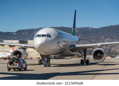 San Bernardino, California, USA - Jan 2022, Air Namibia Airbus A330-200 just arrived at San Bernardino International Airport in Southern California, Marshaller is placing the chocks