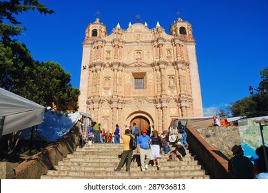 SAN CRISTOBAL DE LAS CASAS, MEXICO - MARCH 19, 2011: Main square in the city with Dominican convent and unidentified people. It is a cultural capital of Chiapas with Spanish colonial architecture
