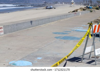 San Diego, CA 4-22-2020   Police Tape Blocking The Entrance To The Beaches At Ocean Beach California On A Sunny Day