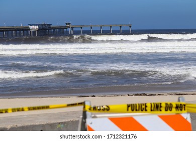 San Diego, CA 4-22-2020   Police Tape Blocking The Entrance To The Beaches At Ocean Beach California On A Sunny Day