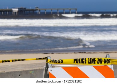 San Diego, CA 4-22-2020   Police Tape Blocking The Entrance To The Beaches At Ocean Beach California On A Sunny Day