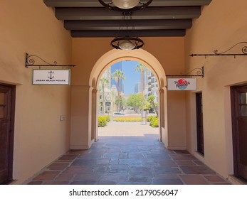 San Diego, CA - June 30, 2022: View Of The Walkway To The Outdoor Shopping Plaza, Downtown Seen Through The Archway.