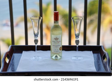 San Diego, CA USA - August 8, 2022: A Bottle Of Stella Rosa Moscato D'asti Wine And Two Fancy Wine Glasses On Top Of A Wooden Tray.