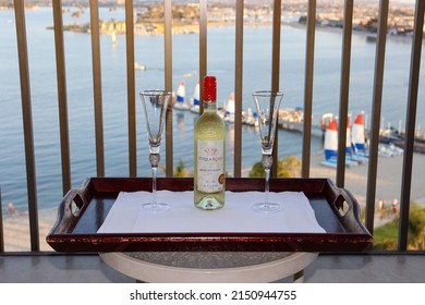 San Diego, CA USA - August 8, 2022: A Bottle Of Stella Rosa Moscato D'asti Wine And Two Wine Glasses On Top Of A Wooden Tray At A Waterfront Balcony 