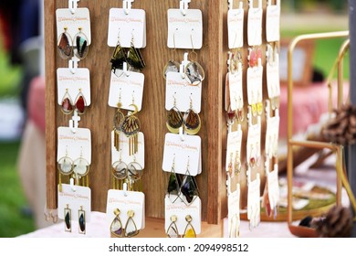 San Diego, CA USA - Dec 5 2021: San Diego Vintage Collective Craft Show: Earrings On A Display In A Craft Booth At The Fair                              