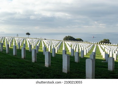 San Diego, CA, USA - December 31, 2021: Headstones At Fort Rosecrans National Cemetery At Point Loma Naval Base With Ocean In Background