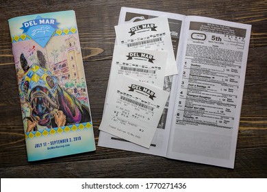 San Diego, CA / USA - February 23, 2020: Del Mar Thoroughbred Club Program And Betting Tickets.