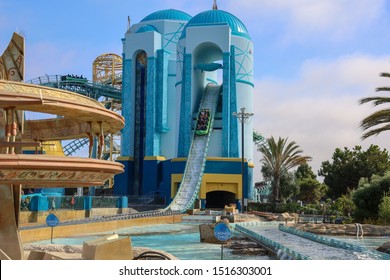 San Diego, CA / USA - July 13, 2019: A Boat Going Down The Steep Hill Of The Journey Of Atlantis Water Coaster In SeaWorld San Diego. Family Having Fun At SeaWorld In California.