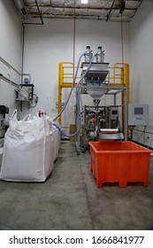 San Diego, CA / USA - July 14, 2019: An Automatic Weigh Fill And Packaging Machine For Bulk Rice At At A Food Bank Warehouse.