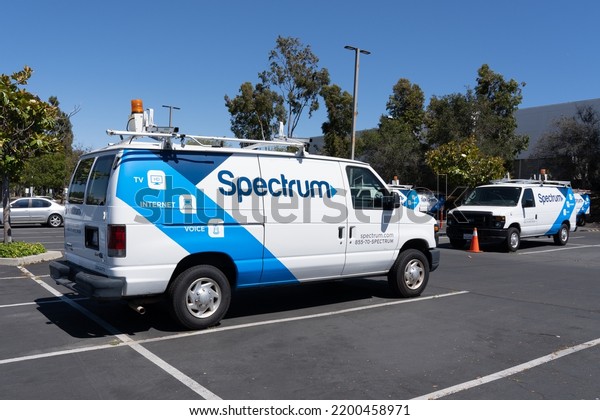 San Diego, CA, USA - July 9,\
2022: Spectrum vans are shown in San Diego, CA, USA. Spectrum is a\
brand of Charter Communications, an American cable operator.\
