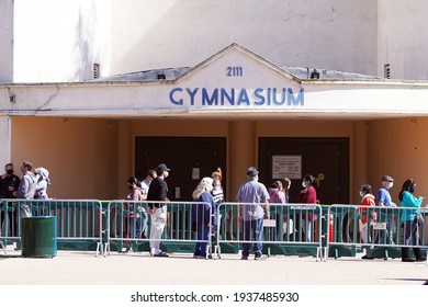 San Diego, CA USA - Mar 12 2021: Balboa Park Gymnasium With Lines Of People Outside Waiting To Get The Coronavirus Vaccine                               