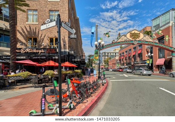 San Diego, CA / USA - March 01 2019: A view from\
Gaslamp Quarter Arc, Historic District of Downtown of San Diego\
rent a scooters lot.