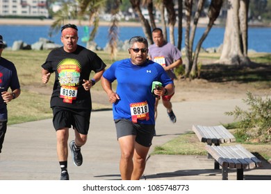 San Diego, CA / USA - May 6, 2018: People Are Running Through Embarcadero Marina Park During The 